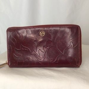VALENTINA burgundy embossed genuine leather zip around wallet. Made in Italy.